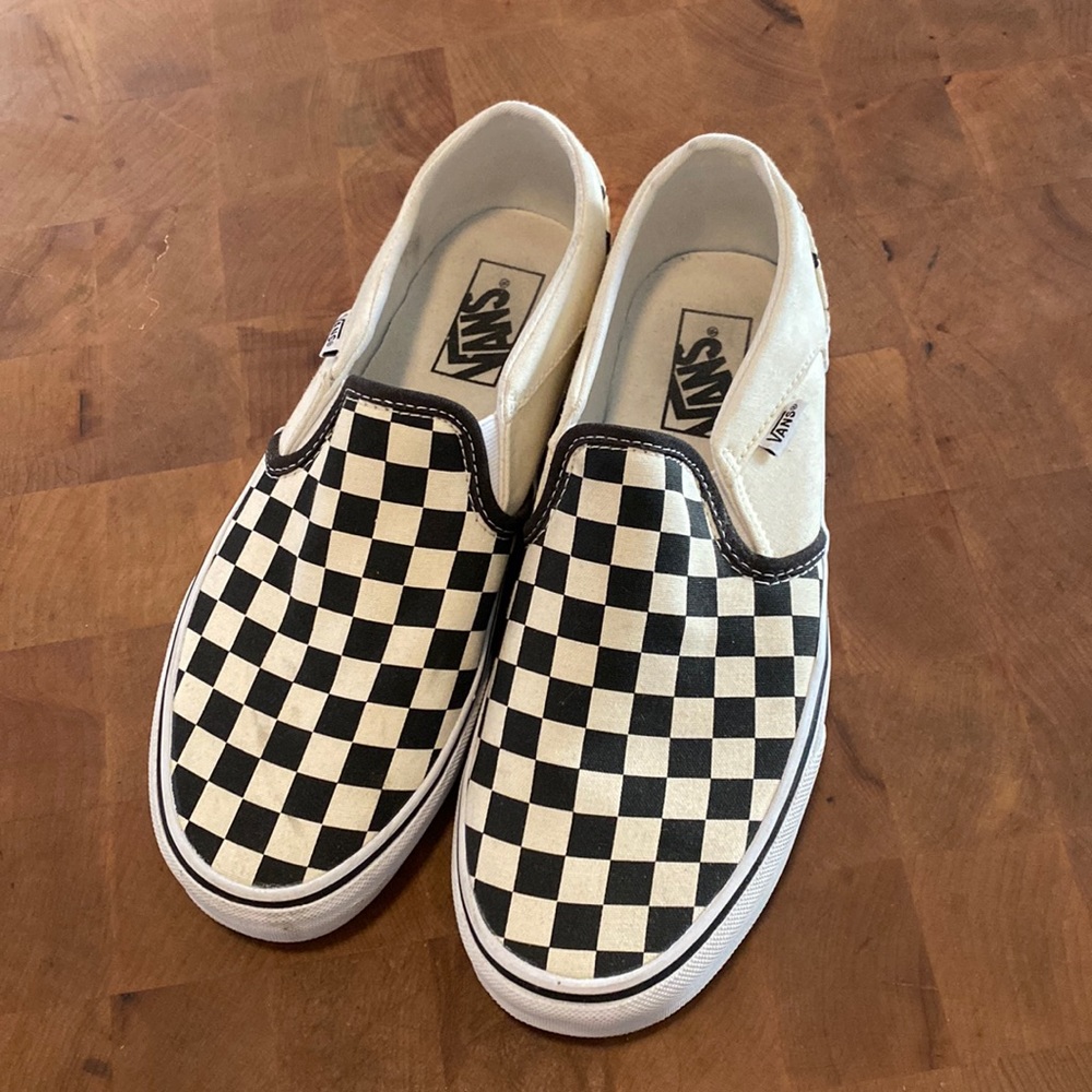 Van’s classic checkerboard slip ons.